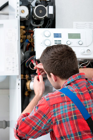 Gas Safe registered heating engineer servicing a gas boiler in Filton