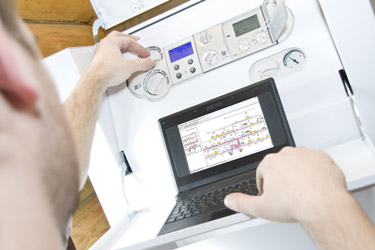 Gas Safe registered heating engineer servicing a gas boiler in Kingswood